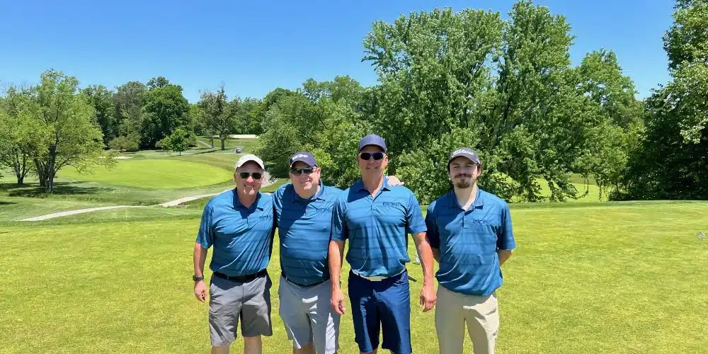 4 men on golf course