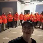 Construction workers in parking lot