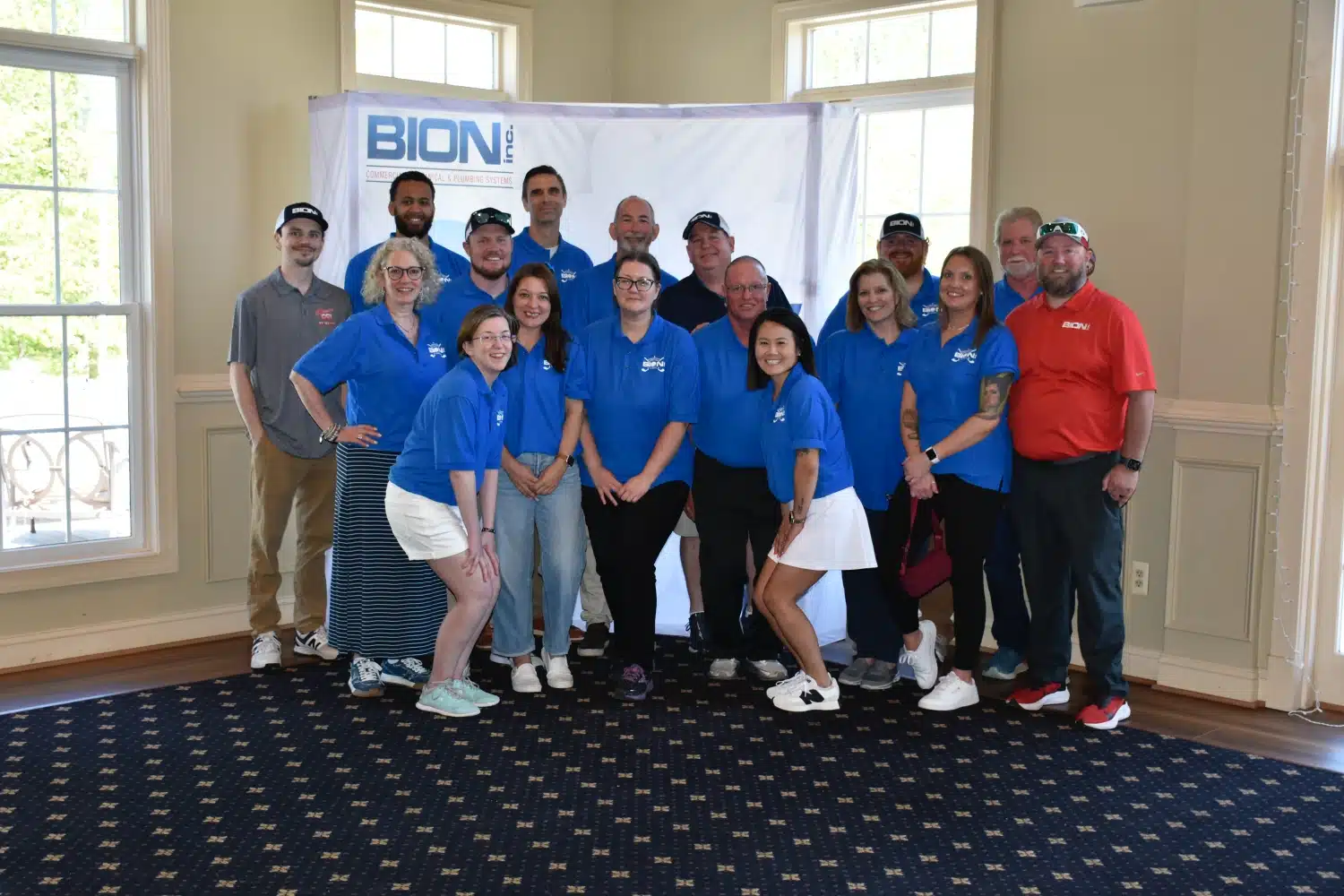 Group of people in blue shirts