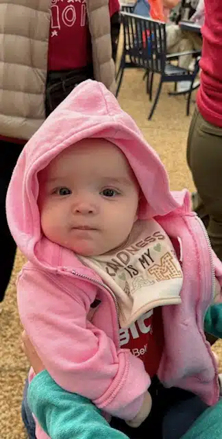 baby wearing pink outfit