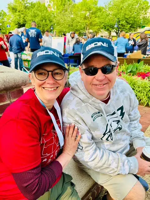 2 people sitting in park